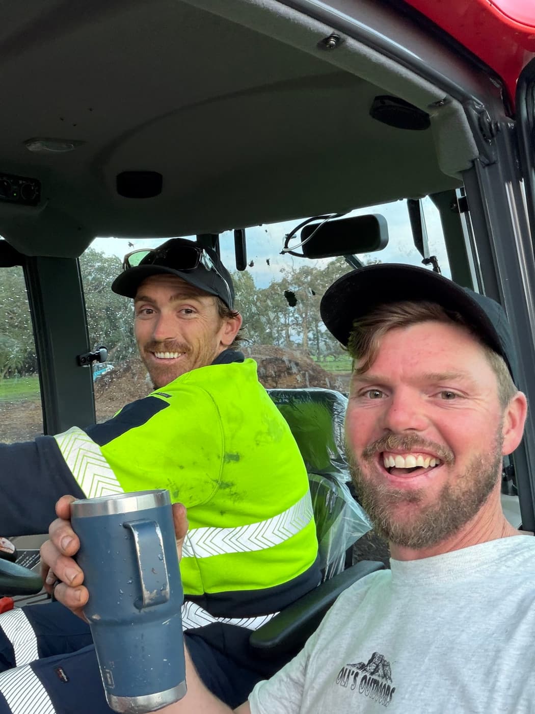 Mitch and Dave in the cab of the tractor at the WildSoil compost site in Busselton